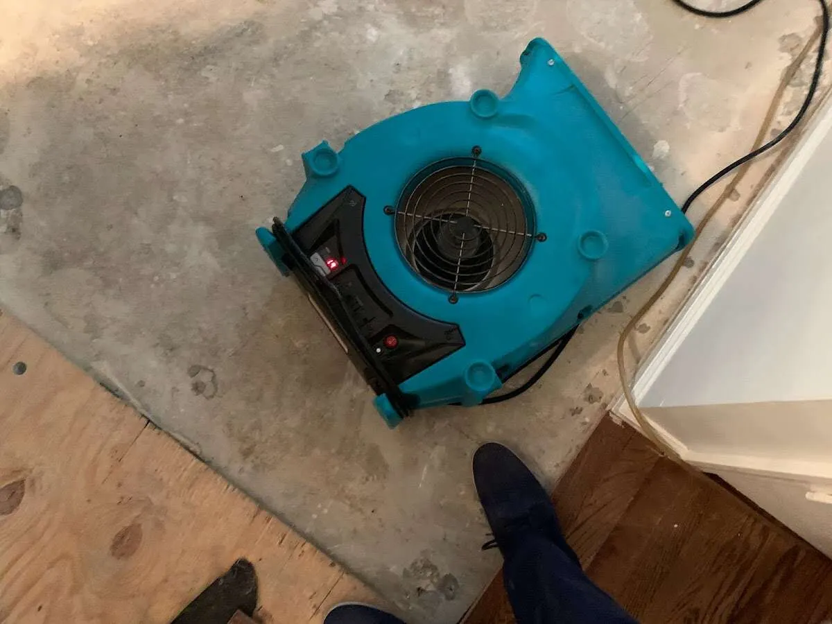 Air mover drying subfloor during Leak Detection & Repair in Oak Hills